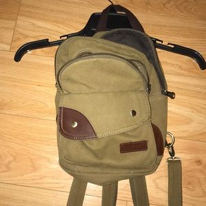 Cute little backpack/purse. Adjustable straps.